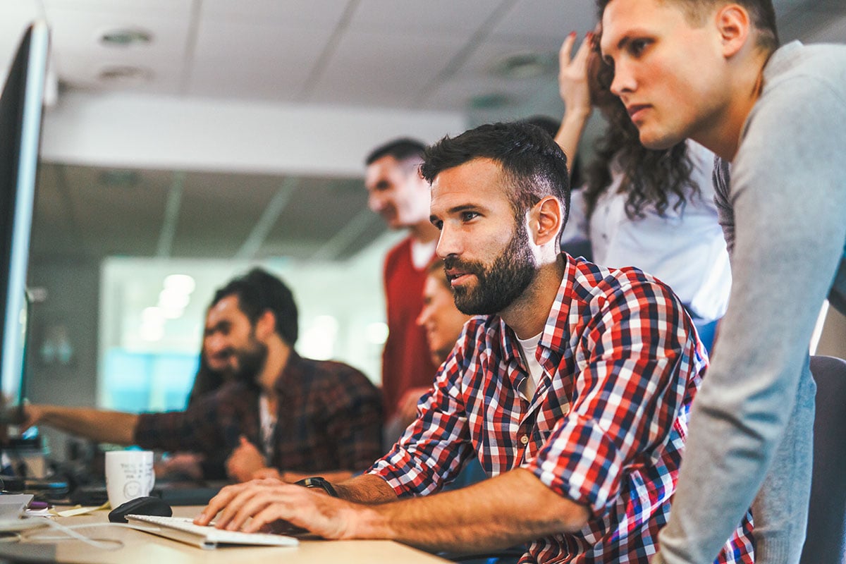 Portrait of programmers working together in software development Portrait of programmers working together in software development