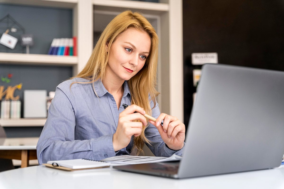 Female teacher working with laptop Female teacher working with laptop